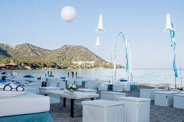 Beachfront wedding party decoration with blue sky
