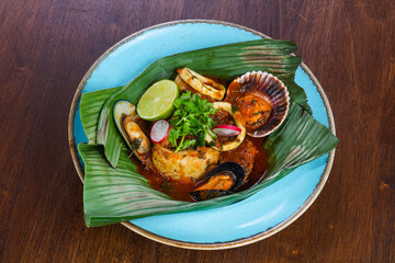 Bouillabaisse soup in the banana leaf