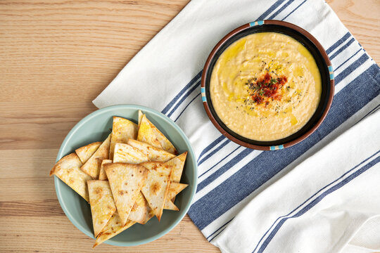 Overhead shot of hummus and pita chips
