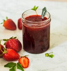 Homemade strawberry jam in a glass bowl