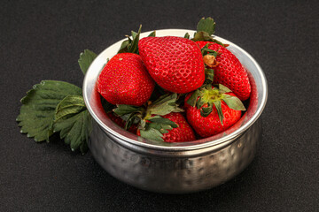 Ripe sweet strawberry with leaf