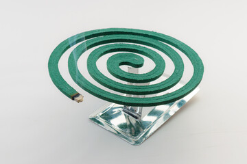 Smoldering mosquito coil repellent stick, burning spiral. mosquito protection