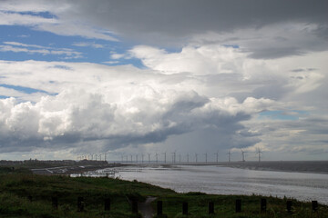 Redcar beach showing dark stormy sky and beach.