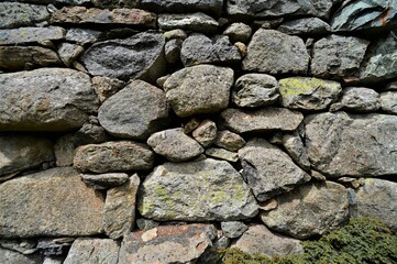 beautiful natural stone wall with different sized gray stones