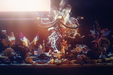 incense in a woman hand, incense smoke on a black background.