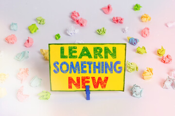 Writing note showing Learn Something New. Business concept for Gain acquire different training,...