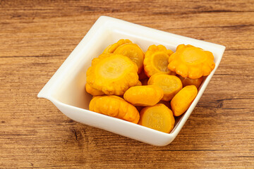 Marinated yellow patisson in the bowl