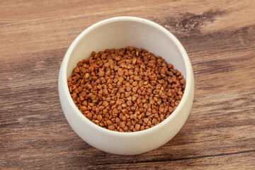 Raw buсkwheat cereal in the bowl