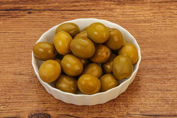 Green pickled olives in the bowl