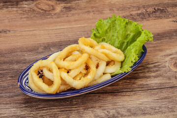 Roasted squid rings with salad