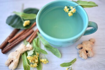 cup of tea with chamomile flowers and cinnamon