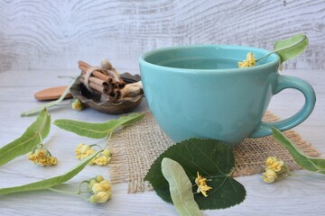 Fototapeta na wymiar Aromatic herbal tea with lime, cinnamon and ginger mix