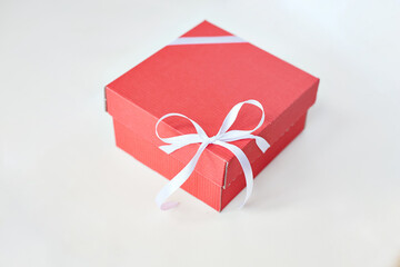 red craft box with a white bow