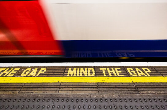 London, UK:   mind the gap tube station sign