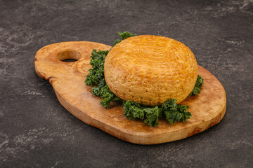 Smoked Georgian suluguni cheese piece