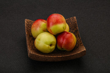 Sweet small nectarines in the basket