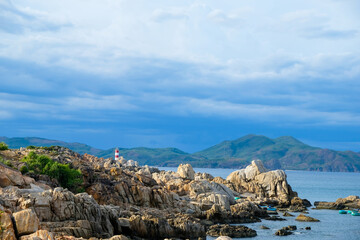 Fototapeta na wymiar Tropical beach with rocks and blue sea in Vietnam