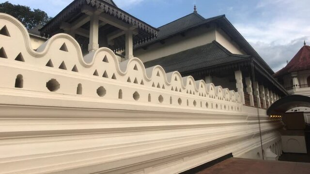Kandy, Sri Lanka, November 25, 2019, Sri Dalada Maligawa along the main wall of the temple