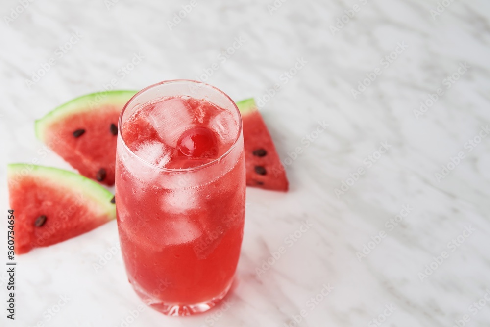 Canvas Prints High angle shot of a red drink near watermelon slices