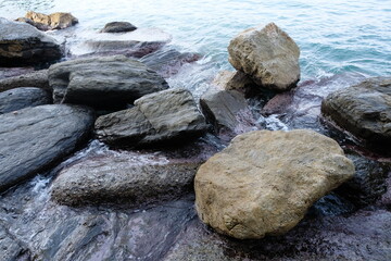 Sea waters hitting the rocks on the coast
