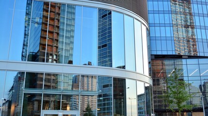 Facade texture of a glass mirrored office building. Fragment of the facade. Modern architecture of the office building.