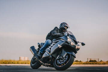 biker rides on the road