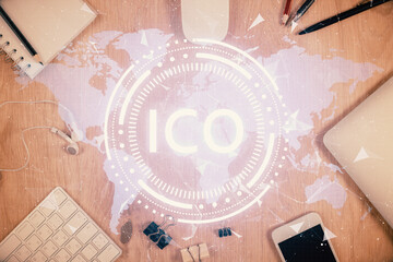 Double exposure of blockchain theme hologram over table with phone. Top view. Crypto technology...