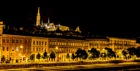 Fototapeta na wymiar A view from the Chain Bridge across the River Danube in Budapest towards the Fisherman's Bastion at night in the summertime