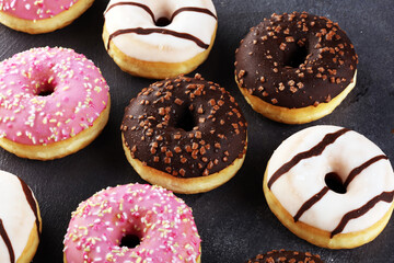 donuts in different glazes frosted with sprinkles