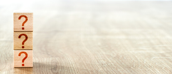Brainstorming Concept. wooden blocks with question marks. FAQ (frequently asked questions)