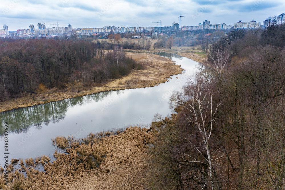 Wall mural Drone shot flying on the spring city park