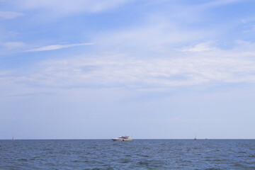 Seascape and Tranquil scene of white sailboat on the ocean 