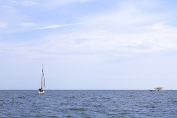 Seascape and Tranquil scene of white sailboat on the ocean 