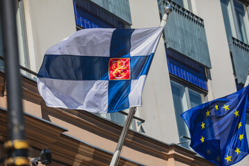 Waving flag of Finland and European Union flag hanging on the finnish institutions and...