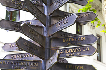 metal street signpost, sign pointing everywhere at the big cities around the world