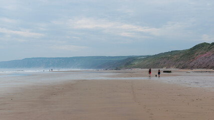 people walking on the beach