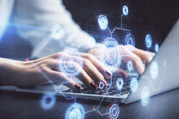 Multi exposure of woman hands working on computer and data theme hologram drawing. Tech concept.