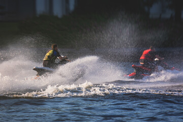 View of jet ski in motion, group of jet skiers with a big water splash