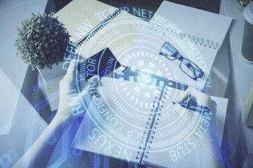 Double exposure of woman on-line shopping holding a credit card and data theme hologram drawing. E-commerce concept.