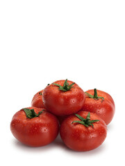 Pyramid combined from five ripe tomatoes covered with drops of water