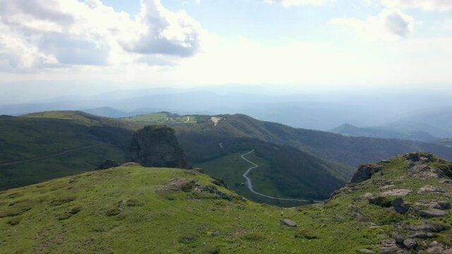 Aerial view drone flying over the top of the mountain in summer day - Babin Zub Old Mountain in Serbia - Freedom and achievement success concept