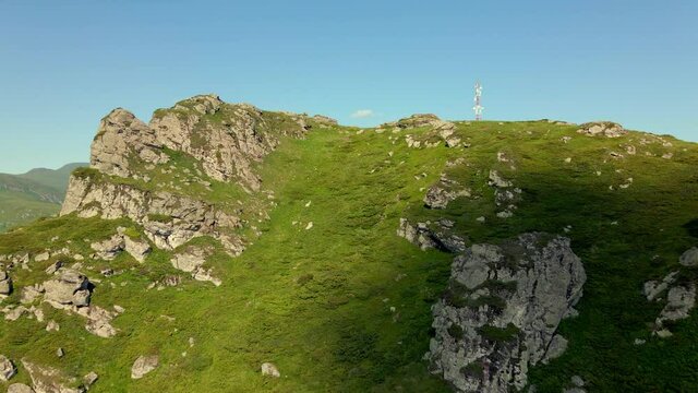 Aerial view drone flying over the top of the mountain in summer day - Babin Zub Old Mountain in Serbia - Freedom and achievement success concept