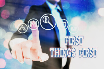 Conceptual hand writing showing First Things First. Concept meaning Business, technology, internet,...