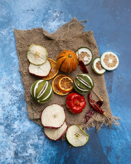 Flat lay top down image of dried seasonal Winter fruit on textured rough background