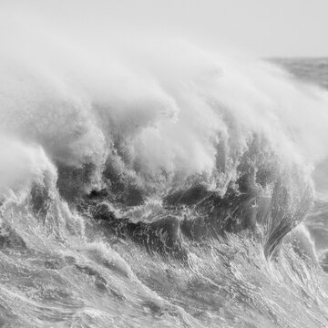 Amzing image of individual wave breaking and cresting during violent windy storm in black and white with superb detail