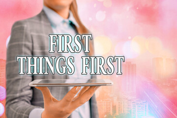 Conceptual hand writing showing First Things First. Concept meaning Business, technology, internet,...