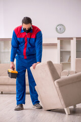 Young carpenter working indoors during pandemic disease
