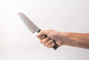 Large kitchen knife in man hand on white background. isolated on white background. Man threaten...