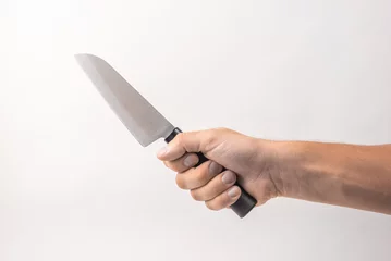 Fotobehang Large kitchen knife in man hand on white background. isolated on white background. Man threaten somebody with knife. Killer concept. Cooking equipment © Konstantin