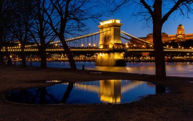 Beautiful SzÃ©chenyi Chain Bridge situated on the river Danube in Hungary shining at night